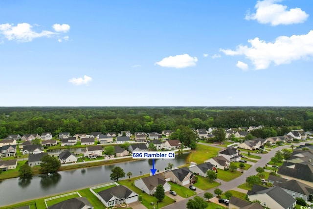 view of property location featuring nearby suburban area and a nearby body of water