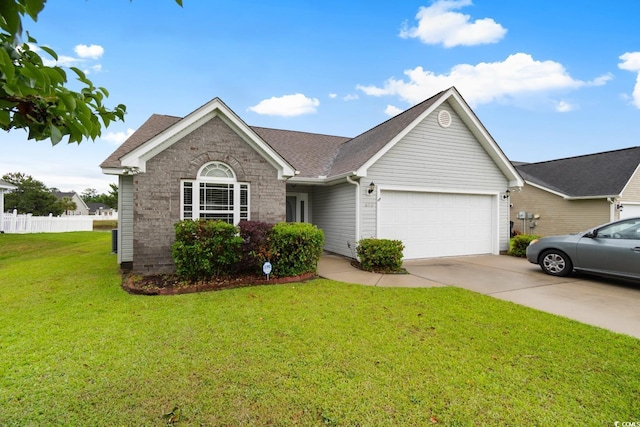 ranch-style house featuring a garage, driveway, and roof with shingles