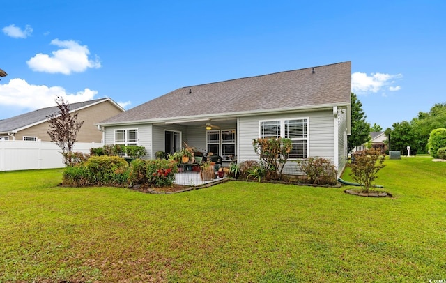 back of property with a ceiling fan and a patio area