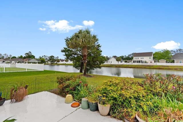 view of patio / terrace featuring a water view and a residential view