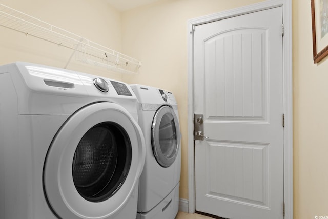 washroom with washer and dryer