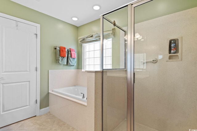 full bathroom featuring a bath, a stall shower, and tile patterned flooring