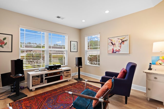 office area with light wood finished floors, baseboards, and recessed lighting