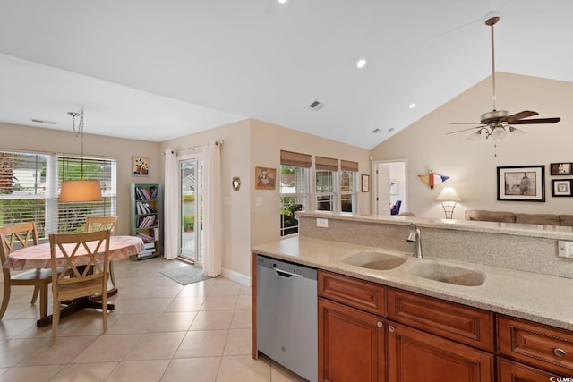 kitchen with dishwasher, a sink, open floor plan, brown cabinetry, and lofted ceiling