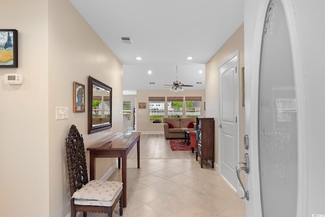 corridor with recessed lighting, baseboards, and light tile patterned floors