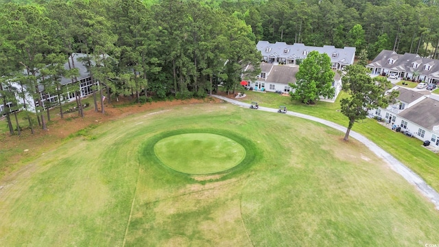 aerial perspective of suburban area featuring a golf course