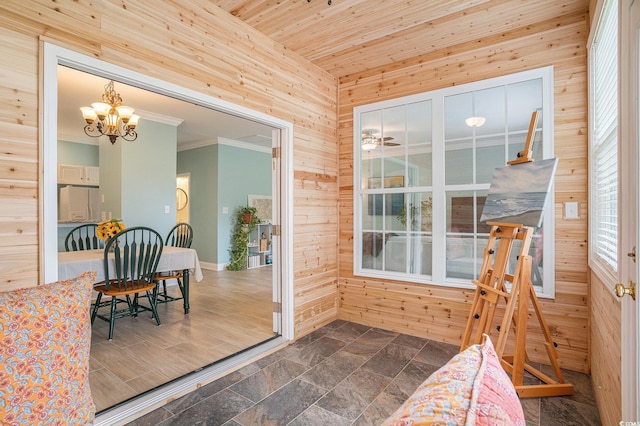 sunroom featuring a chandelier