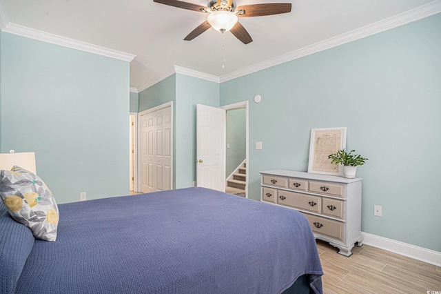 511 Colonial Trace Dr Unit 7-C, Longs, SC 29568 - bedroom with ornamental molding, light wood-type flooring, ceiling fan, and a closet