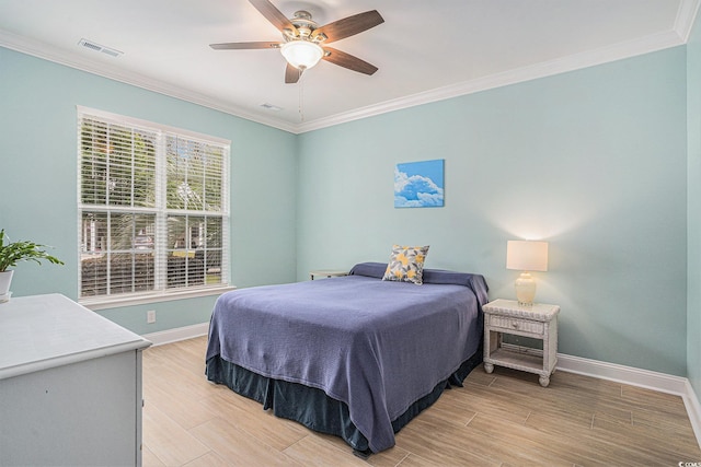 bedroom with baseboards, ornamental molding, light wood finished floors, and ceiling fan