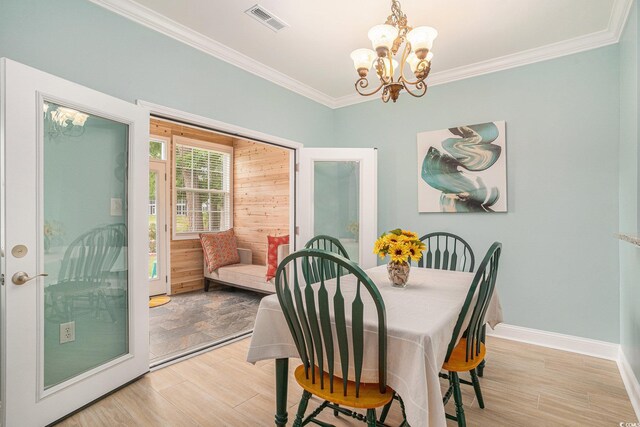 511 Colonial Trace Dr Unit 7-C, Longs, SC 29568 - dining space with a chandelier, light wood-style flooring, and crown molding