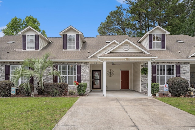 511 Colonial Trace Dr Unit 7-C, Longs, SC 29568 - cape cod-style house featuring a front lawn, a shingled roof, driveway, and a ceiling fan
