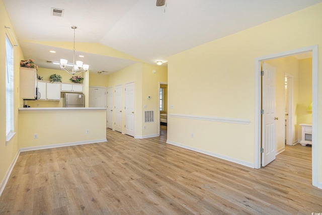 488 River Oaks Dr Unit 61N, Myrtle Beach, SC 29579 - unfurnished living room featuring light wood-style floors, a chandelier, lofted ceiling, and baseboards