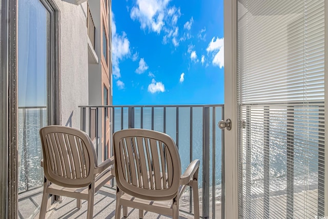balcony featuring a water view