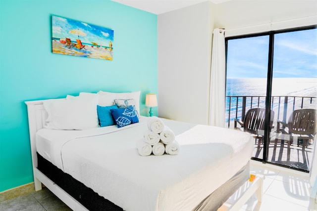 tiled bedroom featuring a water view