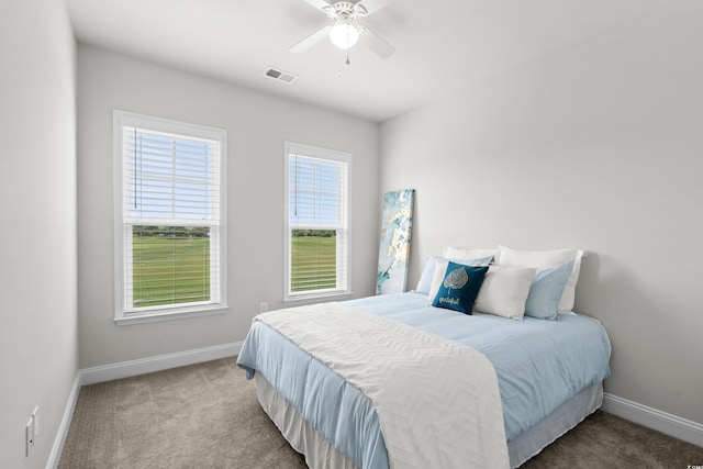 5127 Double Eagle Way Unit 11, North Myrtle Beach, SC 29582 - carpeted bedroom featuring baseboards and ceiling fan
