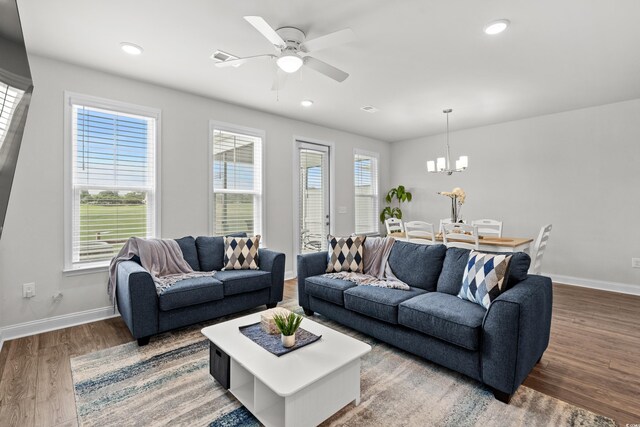 5127 Double Eagle Way Unit 11, North Myrtle Beach, SC 29582 - living area featuring baseboards, a chandelier, wood finished floors, a ceiling fan, and recessed lighting