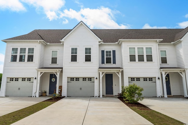 5127 Double Eagle Way Unit 11, North Myrtle Beach, SC 29582 - multi unit property featuring driveway, an attached garage, and a shingled roof