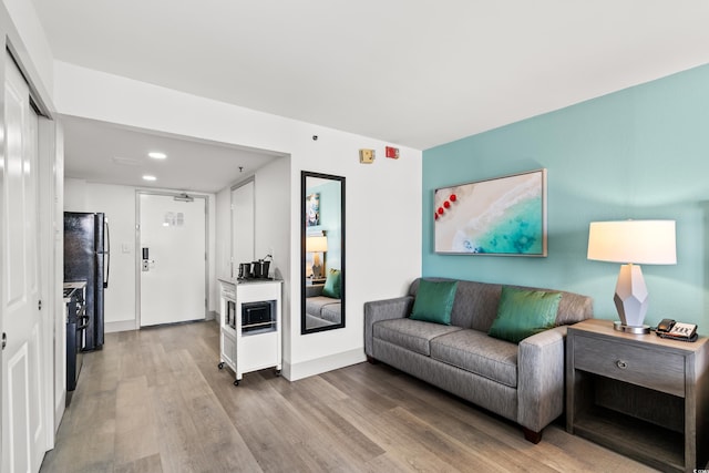 2401 S Ocean Blvd Unit 351, Myrtle Beach, SC 29577 - living room with wood finished floors, baseboards, and recessed lighting