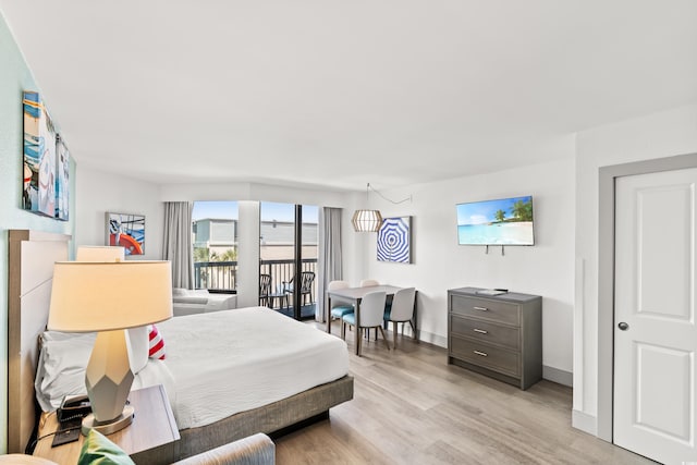 2401 S Ocean Blvd Unit 351, Myrtle Beach, SC 29577 - bedroom with access to exterior, light wood-style flooring, and baseboards