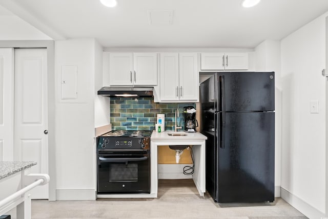 2401 S Ocean Blvd Unit 351, Myrtle Beach, SC 29577 - kitchen featuring black appliances, under cabinet range hood, white cabinets, and backsplash
