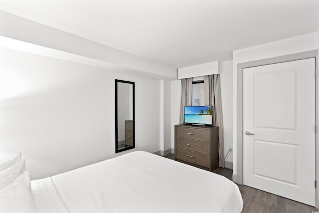 2301 S Ocean Blvd Unit 621, Myrtle Beach, SC 29577 - bedroom with dark wood-type flooring and baseboards