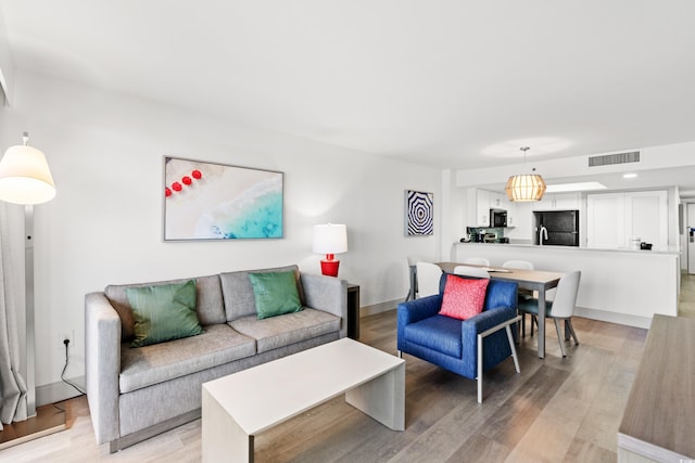 2301 S Ocean Blvd Unit 621, Myrtle Beach, SC 29577 - living room with light wood-style flooring