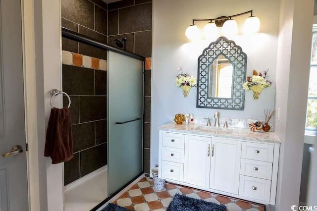 full bathroom with a shower stall and vanity