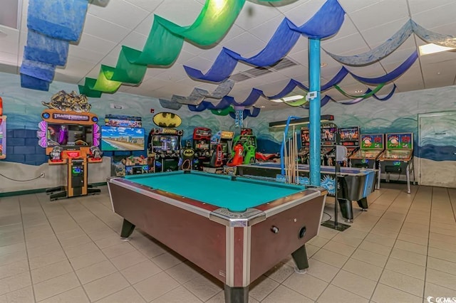recreation room with tile patterned flooring, pool table, and a paneled ceiling