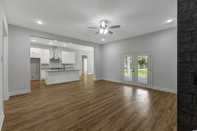4120 Whatuthink Rd, Myrtle Beach, SC 29588 - unfurnished living room with a ceiling fan, dark wood-style floors, baseboards, recessed lighting, and a sink