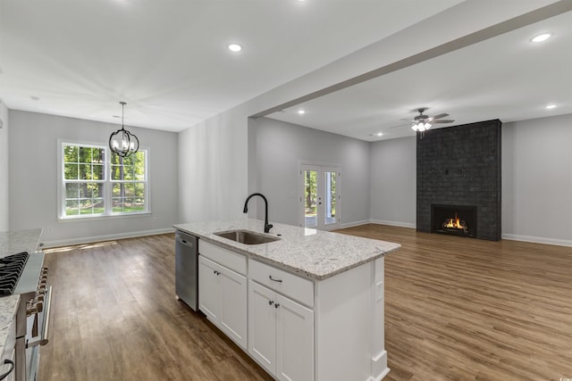 4120 Whatuthink Rd, Myrtle Beach, SC 29588 - kitchen featuring a sink, appliances with stainless steel finishes, open floor plan, wood finished floors, and recessed lighting