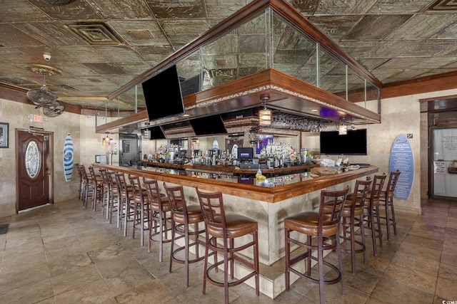 9400 Shore Dr Unit 509, Myrtle Beach, SC 29572 - community bar area with an ornate ceiling and stone tile flooring