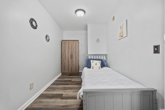 9400 Shore Dr Unit 509, Myrtle Beach, SC 29572 - bedroom with dark wood-style flooring and baseboards