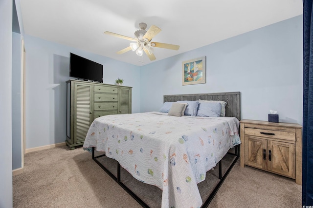 9400 Shore Dr Unit 509, Myrtle Beach, SC 29572 - bedroom with light carpet, baseboards, and a ceiling fan