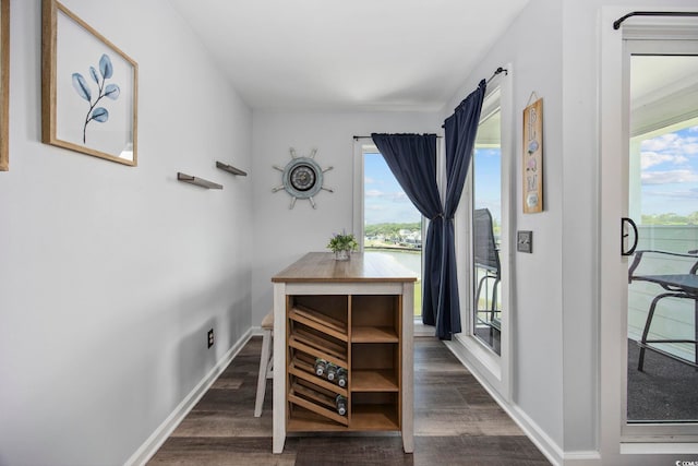 9400 Shore Dr Unit 509, Myrtle Beach, SC 29572 - dining room featuring dark wood-type flooring and baseboards