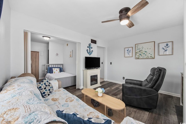 9400 Shore Dr Unit 509, Myrtle Beach, SC 29572 - living area with ceiling fan, dark wood-style floors, and baseboards