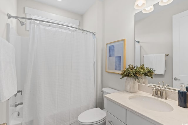 bathroom with toilet, vanity, and shower / tub combo