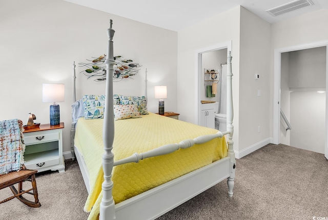 1340 Jolly Roger Dr, North Myrtle Beach, SC 29582 - carpeted bedroom featuring ensuite bathroom and baseboards