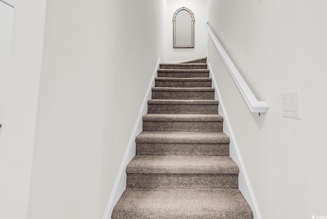 1340 Jolly Roger Dr, North Myrtle Beach, SC 29582 - stairway with baseboards and carpet floors
