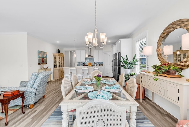 1340 Jolly Roger Dr, North Myrtle Beach, SC 29582 - dining room featuring a chandelier, light wood-style floors, recessed lighting, and ornamental molding