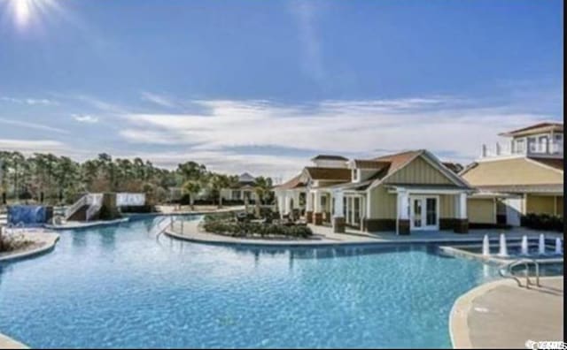 1142 Fiddlehead Way, Myrtle Beach, SC 29579 - community pool with a patio and french doors
