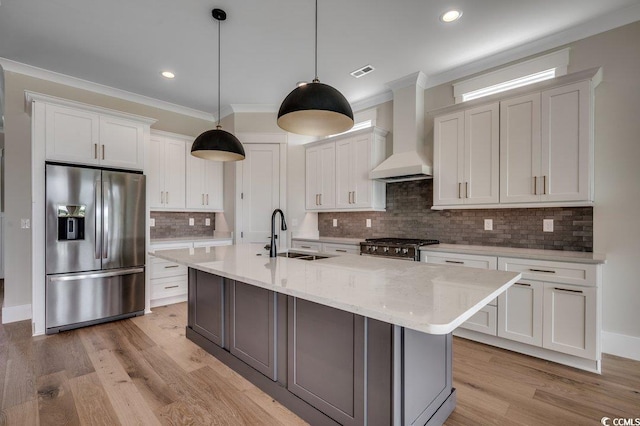 1142 Fiddlehead Way, Myrtle Beach, SC 29579 - kitchen featuring appliances with stainless steel finishes, a sink, wall chimney range hood, light wood-type flooring, and white cabinets