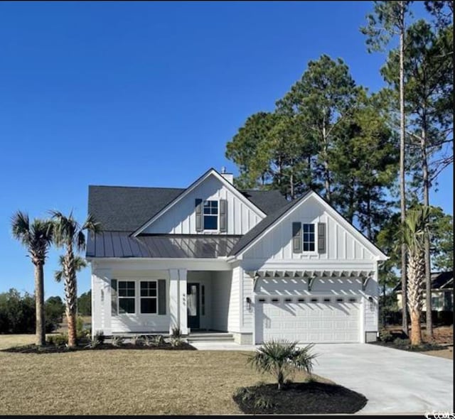 1142 Fiddlehead Way, Myrtle Beach, SC 29579 - modern inspired farmhouse with driveway, covered porch, board and batten siding, a standing seam roof, and an attached garage