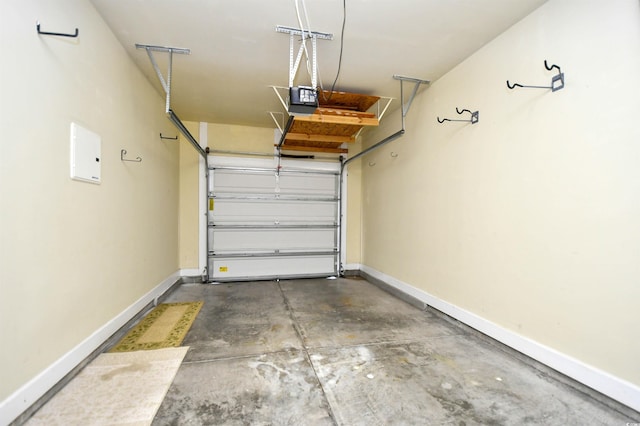 6172 Catalina Dr Unit 515, North Myrtle Beach, SC 29582 - garage featuring a garage door opener and baseboards