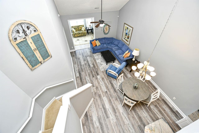 6172 Catalina Dr Unit 515, North Myrtle Beach, SC 29582 - dining room featuring wood finished floors, vaulted ceiling, ceiling fan, and a chandelier