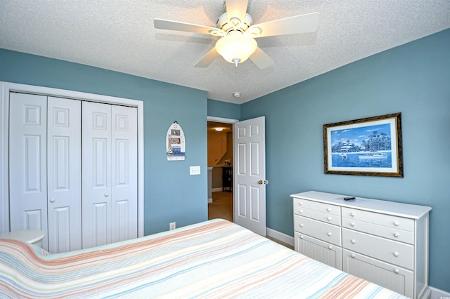 6172 Catalina Dr Unit 515, North Myrtle Beach, SC 29582 - bedroom featuring a closet, ceiling fan, and a textured ceiling