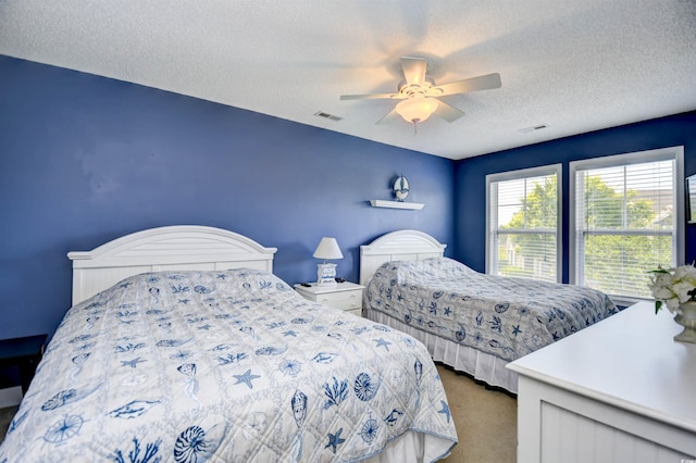6172 Catalina Dr Unit 515, North Myrtle Beach, SC 29582 - bedroom featuring a textured ceiling, carpet flooring, and a ceiling fan