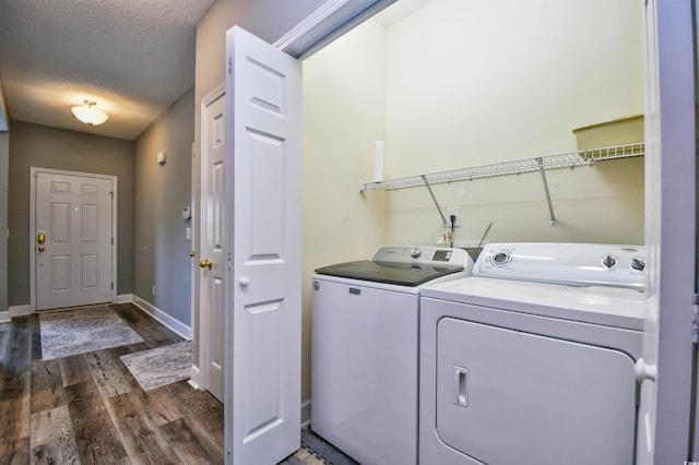 6172 Catalina Dr Unit 515, North Myrtle Beach, SC 29582 - washroom featuring washer and dryer, dark wood-style floors, and a textured ceiling