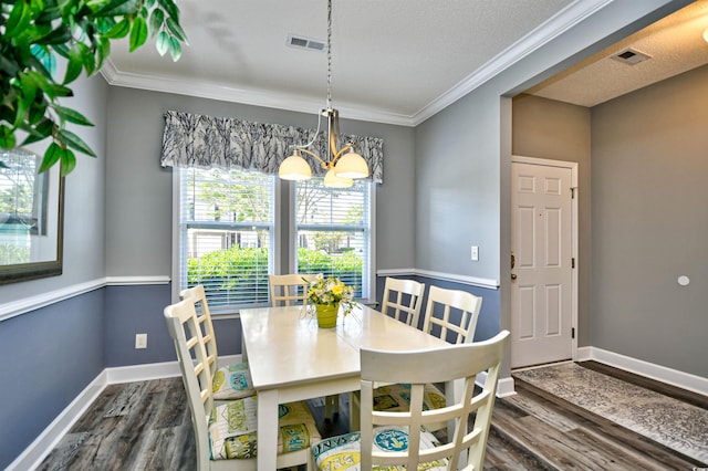 6172 Catalina Dr Unit 515, North Myrtle Beach, SC 29582 - dining area with ornamental molding, a chandelier, and dark wood-style floors
