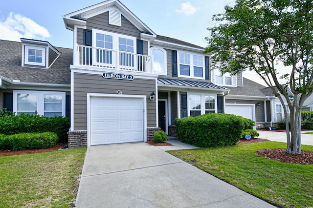 6172 Catalina Dr Unit 515, North Myrtle Beach, SC 29582 - view of front facade with a garage, driveway, a shingled roof, and a front yard