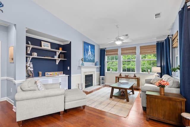 1444 Thames Ct, Myrtle Beach, SC 29577 - living room with ceiling fan, wood finished floors, a glass covered fireplace, baseboards, and lofted ceiling